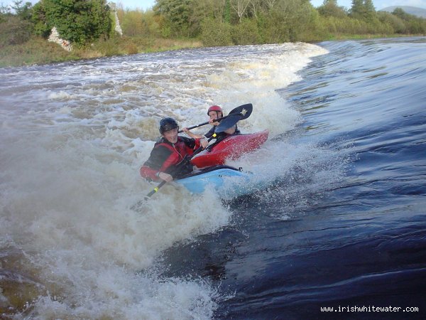 john power & brian somers playing on the second wier at clashganny in high water