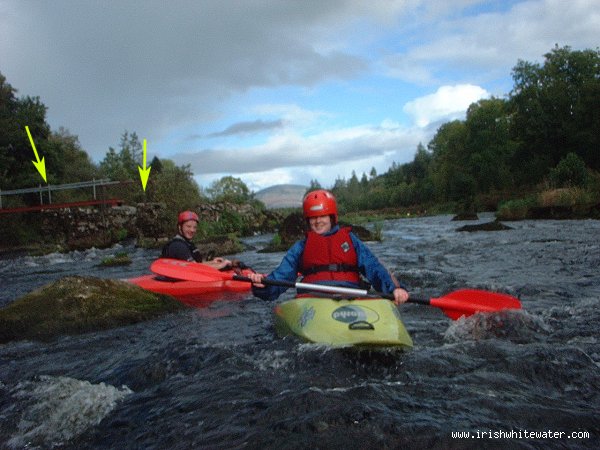 low water look back upstream at beginner and john power from behind v wier at clashganny one arrow shows the salmon gate the other shows the foot bridge river right which can be dodgy @ high water