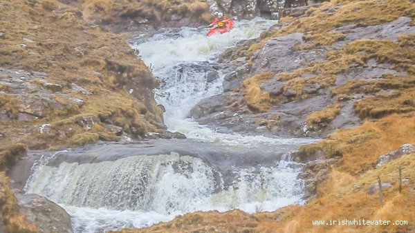Barry Loughnane at the top of some slides , low water